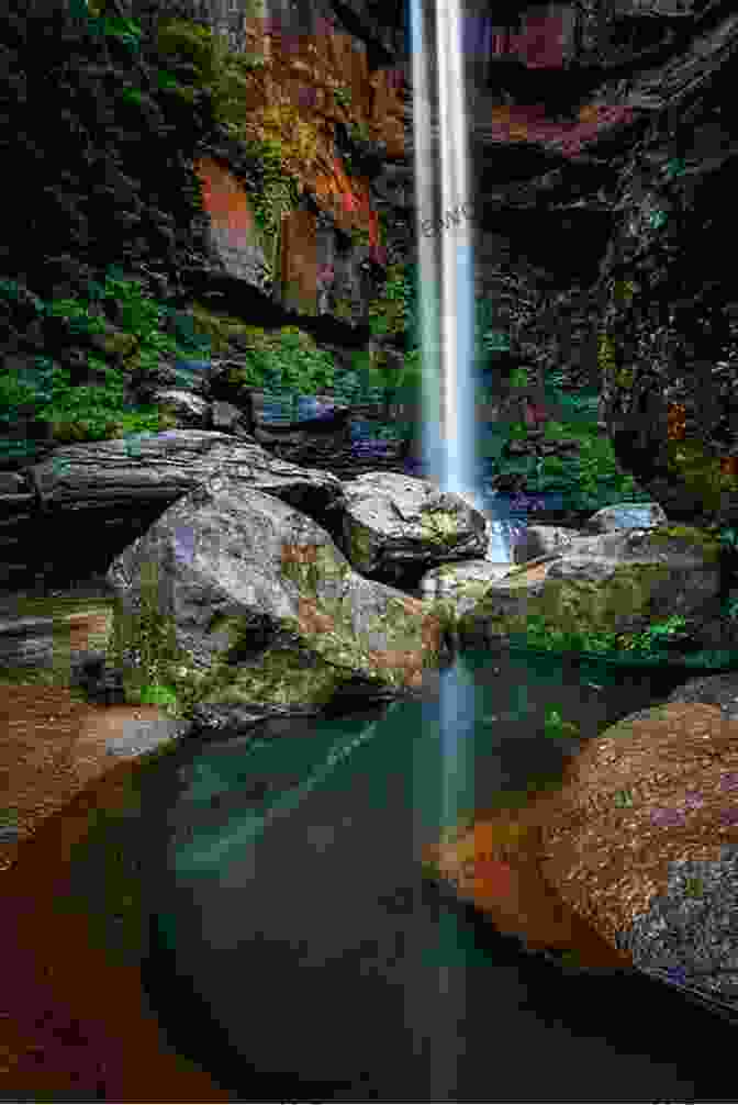 Enchanting Waterfall Tumbling Over A Rocky Cliff On The Southern Shores Hiking Waterfalls North Carolina: A Guide To The State S Best Waterfall Hikes