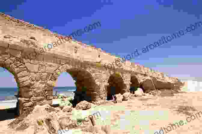 The Remains Of A Roman Aqueduct In Caesarea, Israel, Built To Supply Water To The City. In The Land Of A Thousand Gods: A History Of Asia Minor In The Ancient World